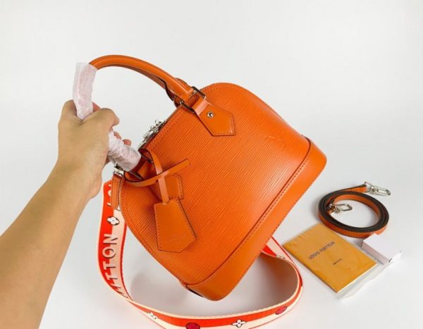 Replica Louis Vuitton Epi Leather Alma BB Handbag In Orange With Jacquard Strap - Image 2