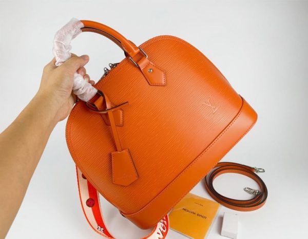 Replica Louis Vuitton Epi Leather Alma PM Handbag In Orange With Jacquard Strap - Image 2