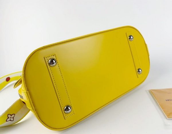 Replica Louis Vuitton Epi Leather Alma PM Handbag In Cedrat Yellow With Jacquard Strap - Image 4