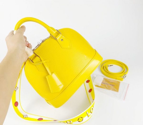 Replica Louis Vuitton Epi Leather Alma BB Handbag In Cedrat Yellow With Jacquard Strap - Image 2